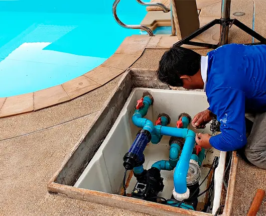 Pool technician performing professional pool maintenance and repair service